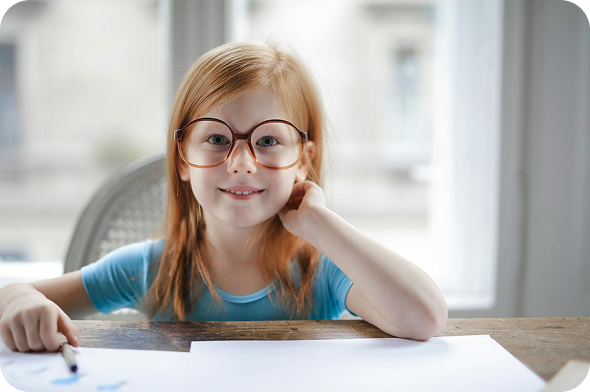 Girl with glasses at study table
